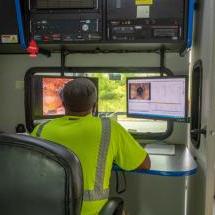 A BWSC employee looking at CCTV footage of inside a sewer/drain pipe